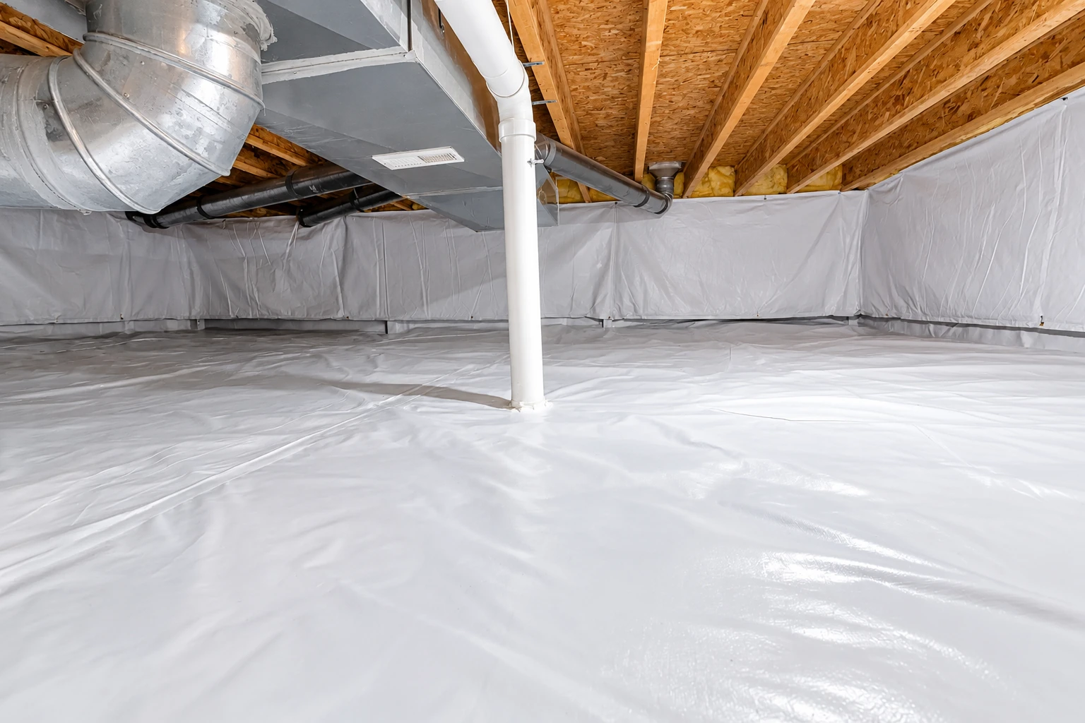 A crawl space has white vapor barrier covering the floor and lower walls beneath exposed joists, ducts, and pipes.